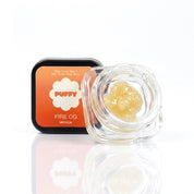 Puffy Fire OG is an indica-dominant THCa strain with bold pine, zesty lemon, and earthy undertones. It delivers a euphoric cerebral lift that eases mental strain before settling into deeply calming, full-body relaxation.