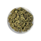 PUFFY Apple Smackz is a sativa-dominant THCa strain, expertly crafted from a flavorful cross between Apple Jack and Grape Pie. The aroma is earthy, musky, and woody, with a rich, natural scent that evokes the feeling of walking through a dense forest surrounded by damp soil and aged wood. Visually, the buds are vibrant lime green with a compact, tapered structure, featuring vivid orange pistils and a frosty layer of white-blue trichomes. Consumers often describe feeling uplifted and clear-headed, with a cal
