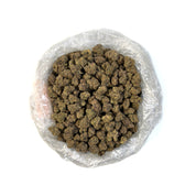 PUFFY GMZ is a potent hybrid THCa strain born from a cross between GMO Cookies and ZCubed (Zkittlez × OG Kush). This cultivar boasts a deep, rich aroma that blends earthy tones with smooth, smoky undertones, creating an inviting and grounding scent profile. Visually striking, its dense, chunky conical nugs range in color from mint to forest green, accented by vibrant orange pistils and a generous coating of milky white crystal trichomes. Consumers often report an intense wave of euphoria that gradually melt