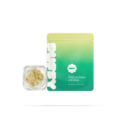 Puffy High Fructose Corn Syrup is a hybrid THCa strain with a sharp citrus aroma layered with chemical funk. It delivers an uplifting cerebral buzz that gently settles into light, calming relaxation, perfect for keeping a smooth, focused mindset.