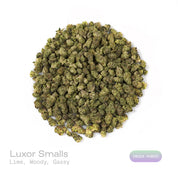PUFFY Luxor (smalls) is an indica-dominant hybrid THCa strain, crafted from the unique union of Triangle Kush and SinMint Cookies. The aroma is a zesty burst of lime, layered with warm woody undertones and a subtle gassy note, creating a bold, energizing, and slightly earthy fragrance. Visually, dense deep green buds with purple hues and fiery orange pistils are coated in sticky trichomes. Consumers often report experiencing euphoria, an uplifted mood, heightened creativity, and a state of relaxed, focused 
