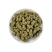 PUFFY MAC 1 (Miracle Alien Cookies) is a balanced hybrid THCa strain, born from the flavorful cross of Alien Cookies F2 with a Miracle 15. The aroma carries smooth notes of butter, uplifted by zesty citrus and rounded out with a creamy finish. Visually captivating, the buds are thick and resinous, shimmering with frosty trichomes, while vibrant orange pistils thread through shades of dark green and purple. Consumers often report it delivers cerebral uplift and body relaxation, with effects that are euphoric
