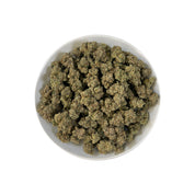PUFFY Marathon OG is a potent indica-dominant hybrid THCa strain, crafted from the legendary OG Kush lineage, which includes either Chemdawg, Lemon Thai, or Hindu Kush. The aroma is bold and layered, combining gassy sharpness with earthy depth and a touch of warm spice. Visually, the buds are dense and deep forest green, accented by darker undertones, vivid bright orange pistils, and a thick coating of frosty white trichomes, signaling its high potency. Consumers often report a balance of euphoria and relax