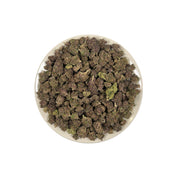 PUFFY Purple Dank is a balanced hybrid THCa strain commonly bred from classic purple indica genetics such as Urkle, Kush, and Granddaddy Purple. The aroma opens with rich woody notes, layered with warm musky undertones and a smooth herbal finish. Visually, dense forest green buds with purple hues and fiery orange pistils are coated in sticky trichomes. Consumers often report a deeply euphoric experience paired with sharp mental focus and a soothing, full-body sense of physical calm. 