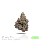 PUFFY Purple Pez is a balanced hybrid THCa strain created through the indulgent cross of Purple Punch and Candy Kush. The aroma delivers a bold fusion of ripe grape, sweet candy-like notes, and sharp gasoline fuel undertones. Visually, dense forest green buds with purple hues and fiery orange pistils are coated in sticky trichomes. Consumers often report an initial euphoric and happy mental uplift with enhanced creativity, followed by a gently relaxing body high that promotes calmness.