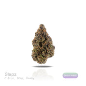 PUFFY Slapz is an indica-dominant hybrid THCa strain, crafted by crossing the renowned Runtz with the potent Grease Monkey. The aroma bursts with sharp citrus notes, layered with tangy sourness and a distinct gassy undertone. Visually, dense deep green buds with purple hues and fiery orange pistils are coated in sticky trichomes. Consumers often report an immediate mental uplift, marked by heightened creativity, a joyful euphoria, and an overall boost in mood.