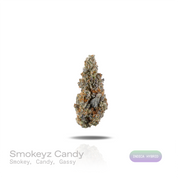 PUFFY Smokeyz Candy is an indica-dominant hybrid THCa strain; the exact lineage remains undisclosed but is believed to trace back to Zkittlez-, Runtz-, and Gelato-family genetics. The aroma offers a captivating mix of smoky warmth, confection-like sweetness, and bold gassy intensity. Visually, dense forest green buds with purple hues and fiery orange pistils are coated in sticky trichomes. Consumers often report a euphoric onset that sparks creativity before gradually settling into a deeply relaxed and calm