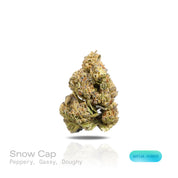 PUFFY Snow Cap is a sativa-dominant hybrid THCa strain bred from the iconic pairing of Snow White and Haze. The aroma is a bold blend of peppery spice, gassy undertones, and rich doughy notes. Visually, dense spring green buds with purple hues and fiery orange pistils are coated in sticky trichomes. Consumers often report feeling euphoric, energetic, uplifted, inspired, and focused, with a noticeable boost in creativity and motivation.