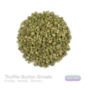 PUFFY Truffle Butter (smalls) is an Indica-dominant hybrid THCa strain, born from the flavorful cross of Gelato and Chocolate Kush. The aroma is a rich, creamy blend with soothing herbal undertones and a subtle buttery note. Visually, the buds are dense and striking, showcasing a deep forest-green base with vibrant purple hues, bright orange pistils, and a sparkling coating of trichomes. Consumers often report an initial burst of euphoria and uplifted mood, gradually giving way to deep physical relaxation, 