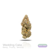 PUFFY Wedding Cake is an indica-dominant hybrid THCa strain created by crossing Triangle Cherry Pie and Girl Scout Cookies (GSC). The aroma is a captivating blend of gassy undertones, sweet fruity notes, and a smooth hint of vanilla. Visually, the buds are dense and vibrant, with forest green and purple hues coated in frosty trichomes and bright orange pistils. Consumers often report a euphoric, uplifted mood paired with a relaxing body high, along with a creative and social spark in lighter use.