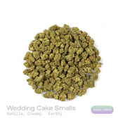 PUFFY Wedding Cake (smalls) is an indica-dominant hybrid THCa strain created by crossing Triangle Cherry Pie and Girl Scout Cookies (GSC). The aroma unfolds with rich, creamy vanilla, complemented by smooth, comforting earthy undertones. Visually, the buds are dense and vibrant, with forest green and purple hues coated in frosty trichomes and bright orange pistils. Consumers often report a euphoric, uplifted mood paired with a relaxing body high, along with a creative and social spark in lighter use.