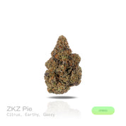 PUFFY ZKZ Pie is a balanced hybrid THCa strain, from the renowned pairing of ZKZ and Georgia Pie. The aroma opens with bright citrus notes layered over a rich earthy base, finished with a bold gassy edge that adds depth and character. Visually, dense green buds with purple hues and fiery orange pistils are coated in sticky trichomes. Consumers often report a bright, uplifting cerebral euphoria that sparks creativity and social energy, followed by a smooth wave of physical relaxation that calms the body.