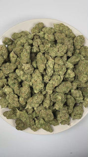 PUFFY Frozen Lemons is a balanced hybrid THCa strain resulting from the strategic pairing of Freezer Burn and Lemon Fire. The aroma is intensely gassy with sharp chemical undertones and a bold fuel-forward finish. Visually, dense forest green buds with purple hues and fiery orange pistils are coated in sticky trichomes. Consumers often report a euphoric, uplifting high that sparks creativity, sharpens focus, encourages conversation, and settles into a smooth, relaxing finish that keeps you feeling clear and