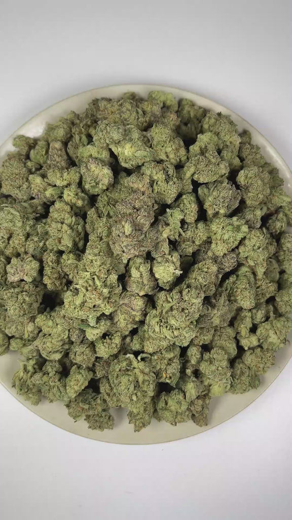 PUFFY Lithium OG Kush is an Indica-dominant hybrid THCa strain crafted from the distinguished cross of OG Kush and Master Kush. The aroma combines pungent notes with classic earthy kush undertones and fresh pine scents. Visually, dense forest green buds with purple hues and fiery orange pistils are coated in sticky trichomes. Consumers often report euphoric and uplifting effects accompanied by a sense of relaxation, calmness, and emotional ease.