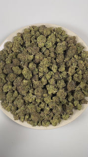 PUFFY Gobbstopper is a balanced hybrid THCa strain meticulously crafted through the expert crossbreeding of Purple Urkle and Sin City Kush. The aroma is a bold blend of candy sweetness layered with sharp ammonia and deep diesel undertones. Visually, the buds are dense, with deep green and purple hues, bright orange pistils, and a sparkling coating of trichomes. Consumers often report a balanced experience of relaxation, euphoria, and uplifted mood, creating a pleasant and enjoyable sensation that can enhanc