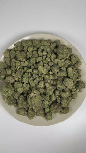 PUFFY ORZ is an indica-dominant hybrid THCa strain derived from the celebrated fusion of  Cookies and Cream and Secret Weapon. The aroma is a delightful blend of doughy sweetness, sugary notes, and creamy undertones. Visually, dense forest green buds with hints of purple are threaded with fiery orange pistils and coated in a sparkling layer of sticky trichomes. The consumers often report a euphoric experience accompanied by a calm, mentally relaxed state that gently soothes the mind and encourages a grounde