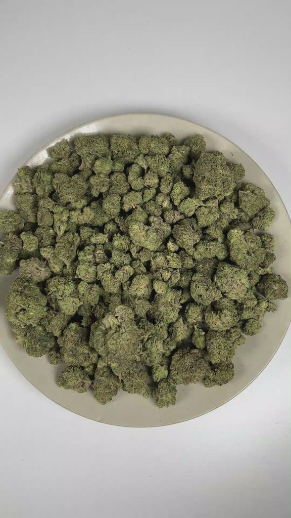 PUFFY ORZ is an indica-dominant hybrid THCa strain derived from the celebrated fusion of  Cookies and Cream and Secret Weapon. The aroma is a delightful blend of doughy sweetness, sugary notes, and creamy undertones. Visually, dense forest green buds with hints of purple are threaded with fiery orange pistils and coated in a sparkling layer of sticky trichomes. The consumers often report a euphoric experience accompanied by a calm, mentally relaxed state that gently soothes the mind and encourages a grounde