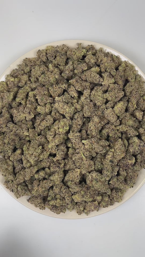 PUFFY Platinum Cake is an indica-dominant hybrid THCa strain hailing from the renowned cross of Wedding Cake and Platinum OG. The aroma is a vibrant blend of bright citrus zest layered with funky, earthy undertones and a bold diesel finish. Visually, dense forest green buds with purple hues and fiery orange pistils are coated in sticky trichomes. Consumers often report an euphoric, relaxed, and lightly stimulating sensation accompanied by a mild cerebral buzz and soothing full-body relaxation.