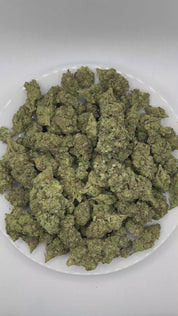 PUFFY Mint Chocolate Chip is a balanced hybrid THCa strain created through the masterful blending of  SinMint Cookies and Green Ribbon. The aroma unfolds with rich notes of chocolate and refreshing mint, finishing with the sweet, comforting essence of Cookies. Visually, dense deep forest green buds with purple hues and fiery orange pistils are coated in sticky trichomes. Consumers often report feeling euphoric and uplifted, while also experiencing a relaxed yet creative and focused state of mind. 