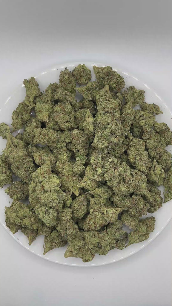 PUFFY Mint Chocolate Chip is a balanced hybrid THCa strain created through the masterful blending of  SinMint Cookies and Green Ribbon. The aroma unfolds with rich notes of chocolate and refreshing mint, finishing with the sweet, comforting essence of Cookies. Visually, dense deep forest green buds with purple hues and fiery orange pistils are coated in sticky trichomes. Consumers often report feeling euphoric and uplifted, while also experiencing a relaxed yet creative and focused state of mind. 