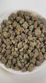 PUFFY Gello is a balanced hybrid THCa strain, born from the flavorful cross of Bacio Gelato and Mochi Gelato. The aroma blends sweet candy notes with a gassy edge and a hint of ripe berries. Visually, the buds are bright neon green with deep amber hues, vivid orange pistils, and a dense coating of chunky amber trichomes. Consumers often describe the effects as an uplifting, euphoric rush that sparks creativity, gradually giving way to deep physical relaxation and enhanced mood. 
