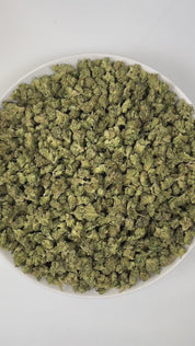 PUFFY Gary Payton (smalls) is a balanced hybrid THCa strain, crafted from the renowned pairing of The Y and Snowman. The aroma opens with a bold burst of sweet onions layered over a rich gassy punch, rounded out by subtle notes of earthy cedar that add depth and warmth to the profile. Visually, buds are dense and frosty, featuring green and purple hues with bright orange pistils and a thick coating of sparkling trichomes. Consumers often report feeling euphoric and cheerful, deeply relaxed, with enhanced fo