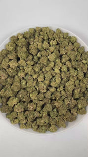 PUFFY E85 is a balanced hybrid THCa strain born from the legendary cross of Wedding Cake and Project 4516. The aroma is rich and complex, combining sharp diesel notes with a pungent intensity, rounded out by deep, earthy woody undertones. Visually, dense forest green buds with purple hues and fiery orange pistils are coated in sticky trichomes. Consumers often report a balanced high that combines euphoric happiness and an uplifted mood, soothing relaxation and a gentle body buzz, and calming effects that he