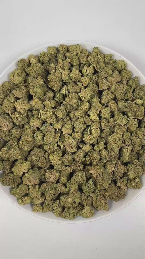 PUFFY E85 is a balanced hybrid THCa strain born from the legendary cross of Wedding Cake and Project 4516. The aroma is rich and complex, combining sharp diesel notes with a pungent intensity, rounded out by deep, earthy woody undertones. Visually, dense forest green buds with purple hues and fiery orange pistils are coated in sticky trichomes. Consumers often report a balanced high that combines euphoric happiness and an uplifted mood, soothing relaxation and a gentle body buzz, and calming effects that he
