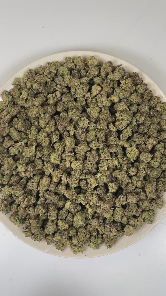 PUFFY Jelly Cake (smalls) is an indica-dominant hybrid THCa strain resulting from a masterful cross between Biscotti and Sunset Sherbet. The aroma unfolds with a delightful blend of fruity sweetness, smooth vanilla, and rich creamy notes. The buds are dense and chunky with deep green and purple hues, bright orange pistils, and a thick layer of sticky white trichomes. Consumers frequently describe a euphoric mental uplift that slowly transitions into soothing, full-body calm, often leaving them cheerful, mel