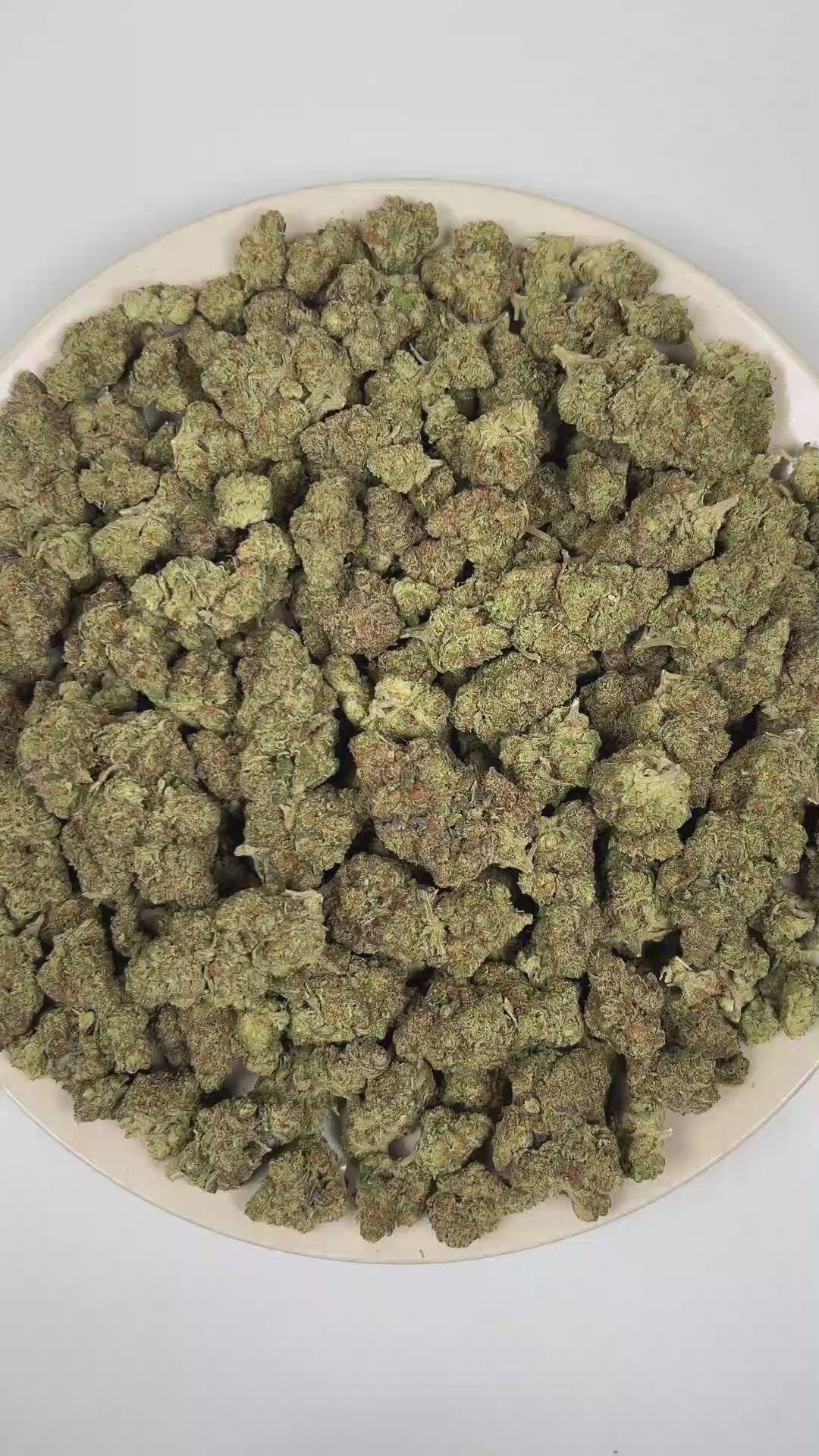 PUFFY Kim Kardashian is an indica-dominant hybrid THCa strain, featuring elite genetics derived from (Tahoe OG × Durango OG) × Kimbo Kush. The aroma opens with bold gassy notes and classic kush-forward earthiness, complemented by a smooth layer of sweet undertones. Visually, dense light lime green buds with purple hues and fiery orange pistils are coated in sticky trichomes. Consumers often report a deeply euphoric experience characterized by profound relaxation throughout the body, an uplifted mood, and no