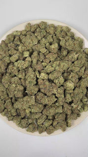 PUFFY Kim Kardashian is an indica-dominant hybrid THCa strain, featuring elite genetics derived from (Tahoe OG × Durango OG) × Kimbo Kush. The aroma opens with bold gassy notes and classic kush-forward earthiness, complemented by a smooth layer of sweet undertones. Visually, dense light lime green buds with purple hues and fiery orange pistils are coated in sticky trichomes. Consumers often report a deeply euphoric experience characterized by profound relaxation throughout the body, an uplifted mood, and no