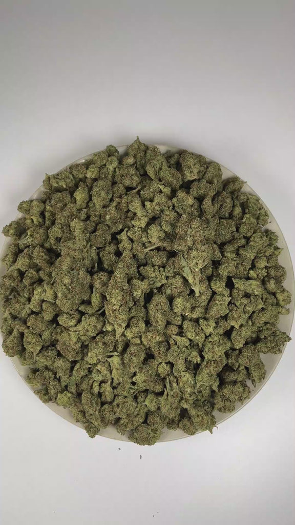 PUFFY Lilac Diesel is a balanced hybrid THCa strain, crafted from the legendary lineage of (Silver Lemon Haze × Forbidden Fruit) × (NYC Cherry Pie × Citral Glue). The aroma is a pungent blend of diesel and chemical notes, rounded out by a sharp, zesty finish. Visually, the dense buds display forest-green tones with deep purple hues, vibrant orange pistils, and a frosty trichome coating. Consumers often report feeling euphoric and uplifted, experiencing a wave of happiness and creative energy that leaves the