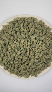 PUFFY Jolly Rancher (smalls) is a balanced hybrid THCa strain resulting from the strategic pairing of Purple Punch and Aloha Grape Stomper. The aroma bursts with sweet candy-like notes layered over ripe grape and juicy berry undertones. Visually, dense forest green buds with purple hues and fiery orange pistils are coated in sticky trichomes. Consumers often report an uplifting euphoric mood boost paired with heightened mental clarity and inspired thinking, along with a relaxing body sensation and sociable,