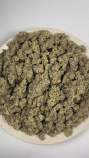 PUFFY High Octane is a balanced hybrid THCa strain bred from a distinguished lineage of Sunset Sherbet and Octane. The aroma is driven by pungent diesel and skunky notes, delivering a bold, fuel-forward finish. Visually, dense forest green buds with purple hues and fiery orange pistils are coated in sticky trichomes. Consumers often report feeling euphoric and deeply relaxed, while also experiencing a boost in creativity, focus, and appetite. 