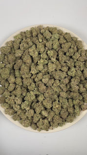 PUFFY Cookies and Cream is a well-balanced hybrid THCa strain crafted from the legendary Starfighter and a rare, secret GSC (Girl Scout Cookies) phenotype. The aroma is rich and indulgent, blending notes of chocolate, coffee, and cream into a smooth, dessert-like profile. Visually, dense forest green buds with purple hues and fiery orange pistils are coated in sticky trichomes. Consumers often report feeling euphoric, relaxed, and uplifted, with enhanced sociability and an overall mood-boosting effect that 