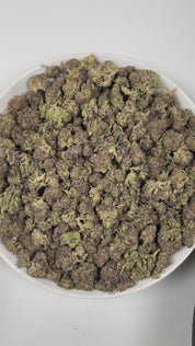 PUFFY Blue Diesel is a balanced hybrid THCa strain, born from the legendary cross between Blueberry and NYC Diesel. The aroma opens with sweet, ripe blueberry notes, blended with sharp diesel undertones and a lively, zesty finish. Visually, the buds are dense and vibrant, showcasing deep forest-green tones accented with subtle purple and indigo hues, bright orange pistils, and a generous coating of sparkling trichomes. Consumers often describe the effects as blissfully euphoric and uplifting, combined with 