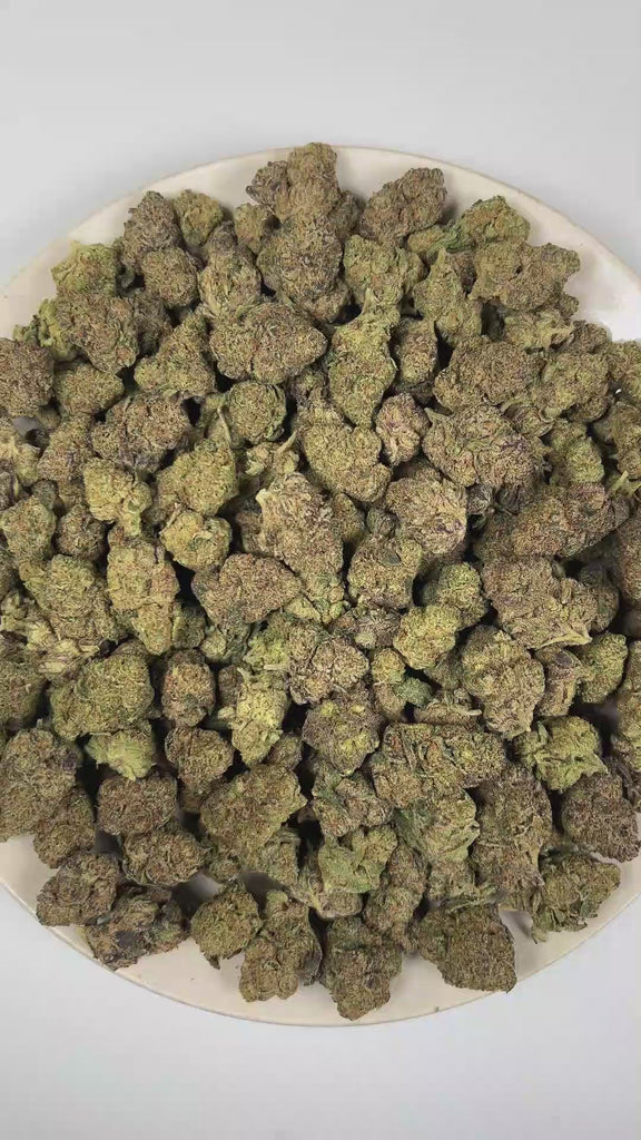 PUFFY Raspberry Donut is a balanced hybrid THCa strain whose genetic lineage remains unconfirmed, as its exact parentage has not been publicly revealed. The aroma opens with ripe berries and rich honey, creating a smooth, inviting fragrance that finishes with a pleasantly sweet note. Visually, dense forest green buds with purple hues and fiery orange pistils are coated in sticky trichomes. Consumers often report a euphoric onset that inspires creativity while gradually settling into a deeply relaxing and ca