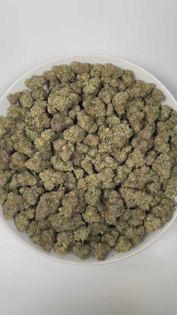 PUFFY Wedding Cake is an indica-dominant hybrid THCa strain created by crossing Triangle Cherry Pie and Girl Scout Cookies (GSC). The aroma is a captivating blend of gassy undertones, sweet fruity notes, and a smooth hint of vanilla. Visually, the buds are dense and vibrant, with forest green and purple hues coated in frosty trichomes and bright orange pistils. Consumers often report a euphoric, uplifted mood paired with a relaxing body high, along with a creative and social spark in lighter use.