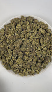 PUFFY Sour Cupcake is a balanced hybrid THCa strain, born from the unique pairing of Sour Diesel and Wedding Cake. The aroma is a vibrant blend of zesty citrus, pungent gassy notes, and sharp diesel undertones. Visually, dense forest green buds with purple hues and fiery orange pistils are coated in sticky trichomes. Consumers often report feeling euphoric and energized, accompanied by mental clarity, heightened creativity and sociability, paired with gentle, soothing body relaxation.