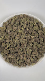 PUFFY Zoap is a balanced hybrid THCa strain born from the exotic blend of Pink Guava and Rainbow Sherbet. The aroma is a bold and distinctive blend of sharp onions, pungent earthiness, and a rich, gassy undertone. Visually, dense earthy green buds with hints of purple are threaded with fiery orange pistils and coated in a sparkling layer of sticky trichomes. Consumers often report a joyful, uplifting euphoria that sparks creativity, followed by gentle body relaxation that enhances comfort, sociability, and 