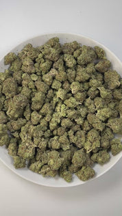 PUFFY King Gelato is an indica-dominant hybrid THCa strain, created from the potent pairing of High Octane and Curelato. The aroma exudes a rich blend of creamy sweetness layered with notes of chocolate and a smooth, buttery finish. Visually, the dense buds showcase deep forest greens with dark accents, bright orange pistils, and a thick layer of sparkling trichomes. Consumers often describe an invigorating yet soothing experience, where a euphoric body eases tension while sharpening focus and lifting the m