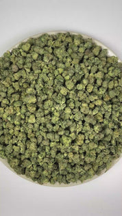 PUFFY Curelato (smalls) is a balanced hybrid THCa strain bred from the exceptional union of Gelato 33 and unconfirmed genetic lineage. The aroma opens with a delightful blend of fruity sweetness, creamy undertones, and rich berry notes. Visually, dense forest green buds with purple hues and fiery orange pistils are coated in sticky trichomes. Consumers often report feeling euphoric, uplifted, and energized, with a positive boost in mood and motivation.