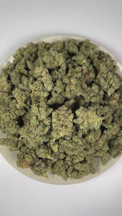 PUFFY Empire OG is a lush indica THCa strain crafted from the masterful pairing of Candy Kush and OG Kush. The aroma blends warm, woody notes with fresh herbal scents and a sharp, peppery finish. Visually, dense forest green buds with purple hues and fiery orange pistils are coated in sticky trichomes. Consumers often report euphoric sensations and soothing relaxation, accompanied by a calming sense of ease that helps melt away stress and tension.