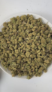 PUFFY Super Sour Nimbus (smalls) is an indica-dominant  hybrid THCa strain, expertly crafted from a potent cross between Super Silver Haze and Sour Diesel. The aroma is a bold fusion of sharp chemicals, zesty citrus, and pungent diesel, creating a striking and unforgettable scent profile. Visually, the buds are dense, featuring green and purple hues, vibrant orange pistils, and a sparkling layer of trichomes. Consumers often report a euphoric, relaxed body high accompanied by improved mood, a sense of happi