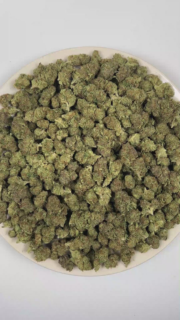 PUFFY 24K Gold is an indica-dominant hybrid THCa strain formulated through the selective pairing of Kosher Kush and Tangie. The aroma features a vibrant blend of zesty grapefruit, sweet bubble gum, and rich fruity notes. Visually, dense forest green buds with purple hues and fiery orange pistils are coated in sticky trichomes. Consumers often report a euphoric and uplifting cerebral buzz that enhances mood and creativity before easing into a gentle, soothing body relaxation, potentially helping to ease stre