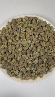 PUFFY Zoap (smalls) is a balanced hybrid THCa strain born from the exotic blend of Pink Guava and Rainbow Sherbet. The aroma opens with a bold kush-forward earthiness, layered with savory onion-like sharpness and finished by a subtle, sweet fruity undertone. Visually, dense earthy green buds with hints of purple are threaded with fiery orange pistils and coated in a sparkling layer of sticky trichomes. Consumers often report a joyful, uplifting euphoria that sparks creativity, followed by gentle body relaxa