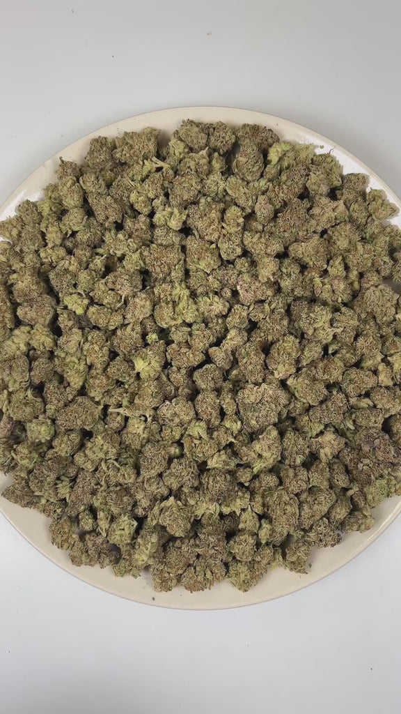 PUFFY Zoap (smalls) is a balanced hybrid THCa strain born from the exotic blend of Pink Guava and Rainbow Sherbet. The aroma opens with a bold kush-forward earthiness, layered with savory onion-like sharpness and finished by a subtle, sweet fruity undertone. Visually, dense earthy green buds with hints of purple are threaded with fiery orange pistils and coated in a sparkling layer of sticky trichomes. Consumers often report a joyful, uplifting euphoria that sparks creativity, followed by gentle body relaxa