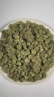 PUFFY Blueberry is an indica-dominant hybrid THCa strain descended from an iconic lineage of Purple Thai and Thai. The aroma is a rich blend of sweet blueberry, bold fuel, and pungent gassy notes. Visually, dense deep forest green buds with purple hues and fiery orange pistils are coated in sticky trichomes. Consumers often report feeling euphoric and focused while remaining calm, relaxed, and gently soothed. 