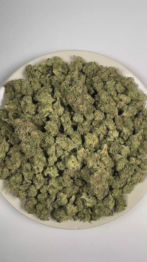 PUFFY Blueberry is an indica-dominant hybrid THCa strain descended from an iconic lineage of Purple Thai and Thai. The aroma is a rich blend of sweet blueberry, bold fuel, and pungent gassy notes. Visually, dense deep forest green buds with purple hues and fiery orange pistils are coated in sticky trichomes. Consumers often report feeling euphoric and focused while remaining calm, relaxed, and gently soothed. 