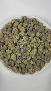 PUFFY Gary's Cherries is a well-balanced hybrid THCa strain, born from the exquisite cross of Cherry Fritter and Gary Payton. The aroma is a zesty fusion of tangy lime, sweet candy, and pungent gassy notes, creating a vibrant and irresistible scent. Visually, the dense buds display forest green and purple hues, highlighted by orange pistils and a sparkling layer of trichomes. Consumers often report a balanced high that begins with an uplifting, clear-headed euphoria, followed by gentle relaxation, making it